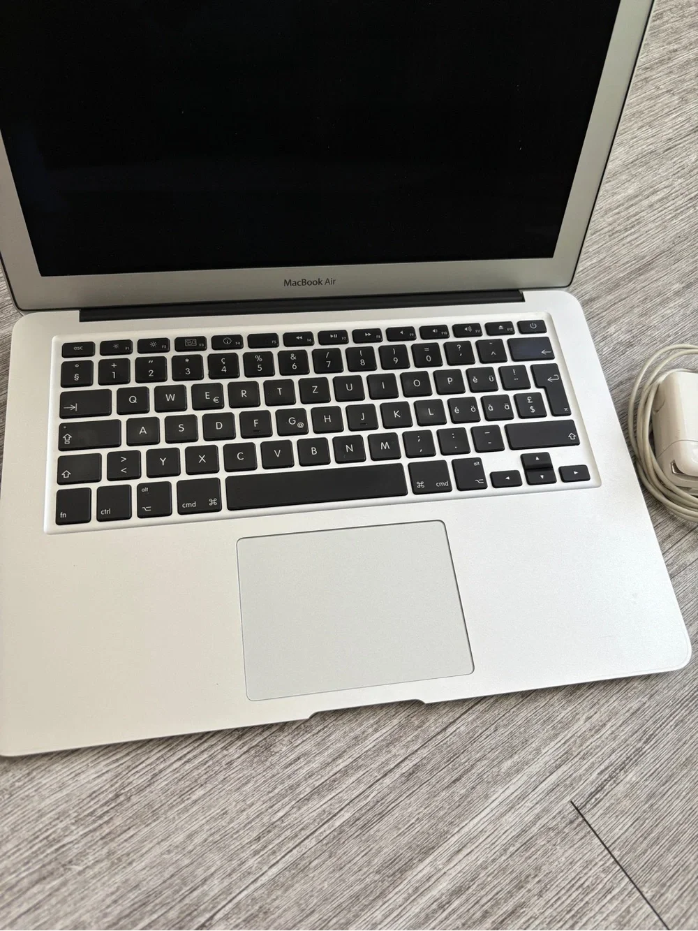 Apple Laptop in Silver with Charger Cord